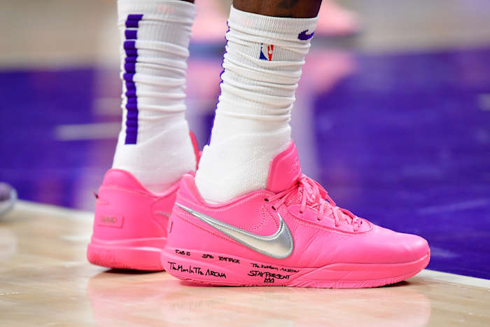 View of LeBron James' pink and silver Nike sneakers.